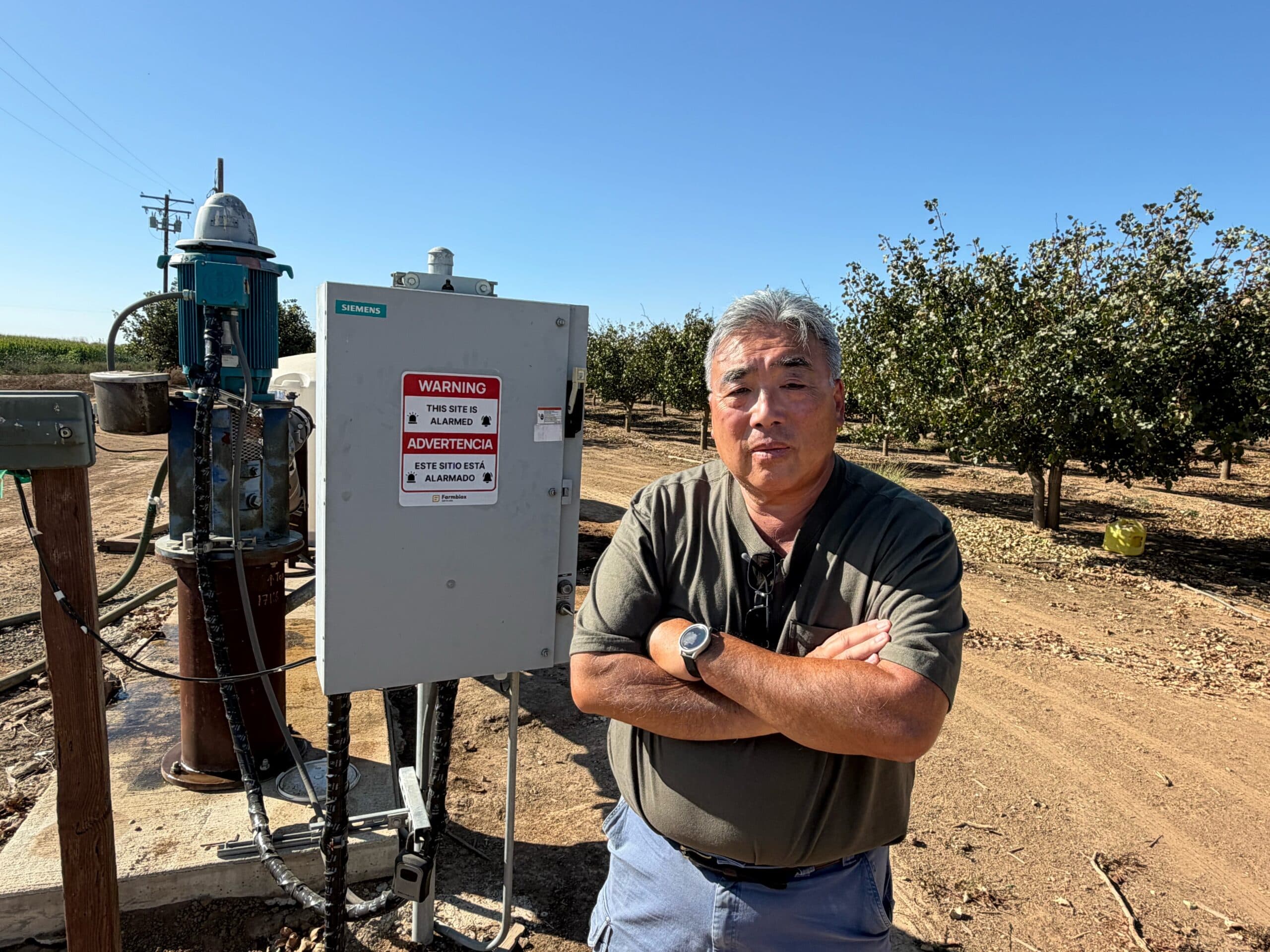 Ray Yeung at pistachio irrigation site following copper theft incidents